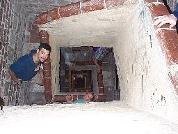 Coming back down the tower in Siena. Forrest and Tamara are also leaning into the center well, but they're several levels down.