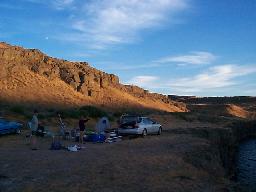 The shadow of the canyon rising on the cliffs behind us.