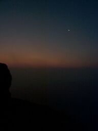 Waiting for dawn atop the pyramid of Mycerinus, with a sliver of moon in the sky.