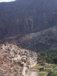 The canyon walls beyond the town.