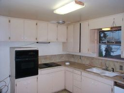 A shot of the kitchen.  Are these the original 1958 cabinets?  And a small window.