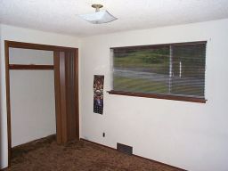 The spare (small) bedroom.  Sparkly ceiling, dark brown carpet.