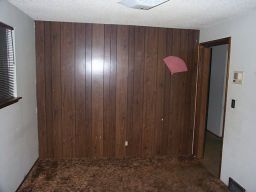 The spare (small) bedroom, from another angle.  Gotta love fake wood paneling.  And all rooms had intercoms.