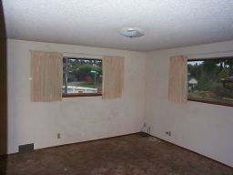 The large bedroom.  Brown carpet, sparkly ceiling, but a lot of floor space.