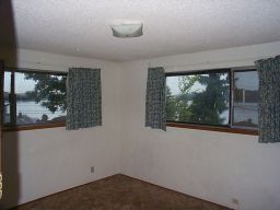 The master bedroom (small).  Lovely curtains.  And a great view.