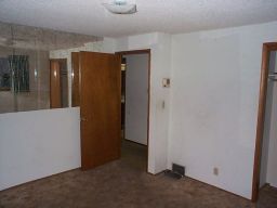 Looking back out of the master bedroom.  Mirrored wall, and (of course) another intercom.