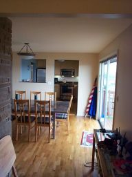 Looking across the dining room into the kitchen.